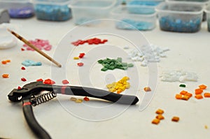 Tools for occupation of a color glass mosaic: brushes, glue, cutters. Creativity and learning.