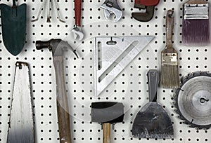 Tools organized on a pegboard in a garage