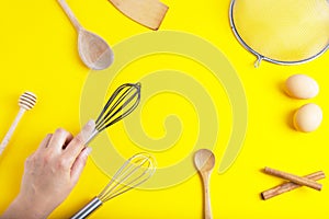 Tools pastry kitchen utensile for cooking dessert, over yellow background with copy space, still life. Top view. photo