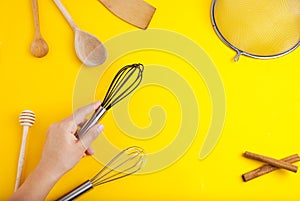 Tools pastry kitchen utensile for cooking dessert, over yellow background with copy space, still life. Top view. photo