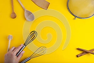 Tools pastry kitchen utensile for cooking dessert, over yellow background with copy space, still life. Top view. photo