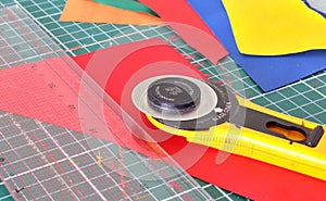 Tools for patchwork: knife, ruler and cutting out the mat