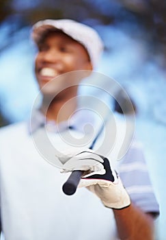 Tools of the pro golfer. a confident african american golf player holding a driver.