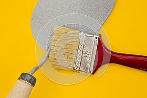 Tools for repair on plain yellow background