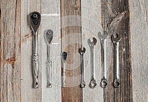 Tools, set wrenches on a wood background