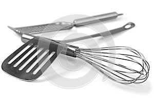 Kitchen steel tools isolated on white photo