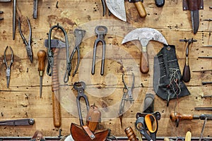 The tools of a tanner on the wall in a tannery.