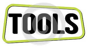 TOOLS text on green-black trapeze stamp sign