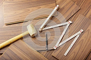 Tools to laying laminate on the wooden floor