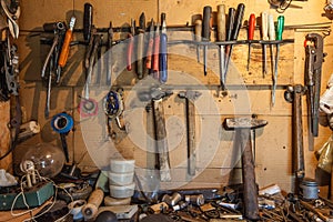 The tools on the wall and table to keep hammers, wrenches, ring spanners, hammer, pliers, screwdrivers, monkey wrenches, screws