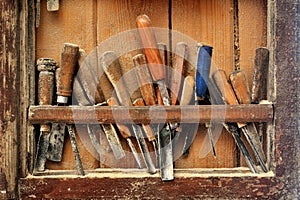 Tools for woodcarving on the shelf photo