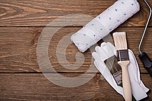 Tools for working with paint. Brush, roller and gloves