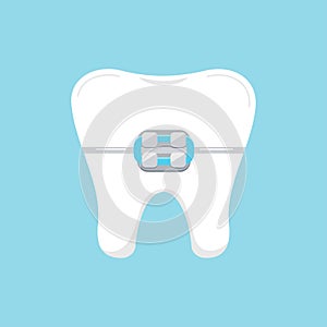 Tooth in braces dental icon isolated on blue background