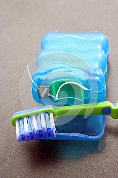 Tooth brush and floss. Used toothbrush and floss.
