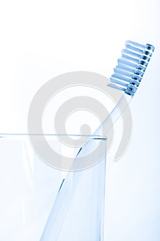 Tooth brush in glass Isolated on white background