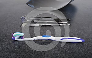 Tooth brush and paste with dental tools. Clean your teeth scene