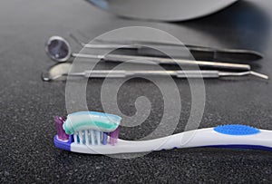 Tooth brush and paste with dental tools. Clean your teeth scene