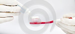 Tooth brushing tecnique with toothpaste isolated in white background
