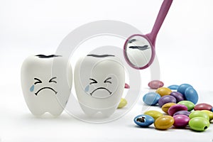 Tooth decay is crying with dental mirror