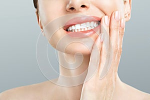 Tooth Pain And Dentistry. Young Woman Suffering From Strong Teeth Pain, Touching Cheek With Hand. Female Feeling Painful