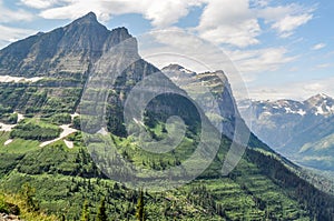 A Tooth Shaped Mountain Projects High Above the Valley Floor in Glacier National Park