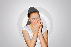 Toothache. Teeth problem. Woman feeling tooth pain. Closeup of beautiful sad girl suffering from strong tooth pain. Attractive fem