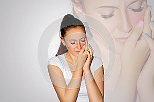 Toothache. Teeth problem. Woman feeling tooth pain. Closeup of beautiful sad girl suffering from strong tooth pain. Attractive fem