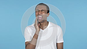 Toothache, Young African Man with Tooth Pain, Blue Background