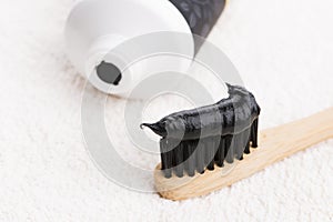 Toothbrush with black charcoal toothpaste