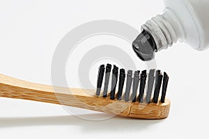 Toothbrush with black charcoal toothpaste