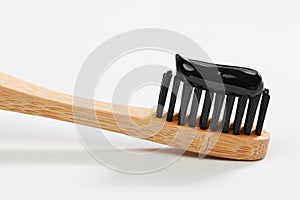 Toothbrush with black charcoal toothpaste