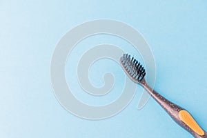 Toothbrush on a blue background with space for text