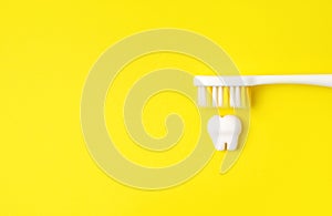 Toothbrush brushing tooth.