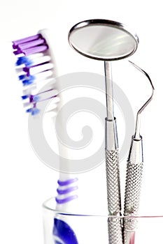 Toothbrush and Dental mirror - explorer in glass