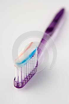 Toothbrush loaded with toothpaste