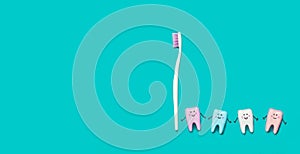 Toothbrush and many teeth on blue background. Minimal