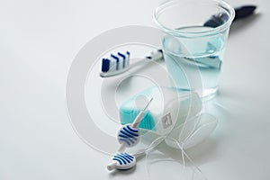 Toothbrush, mouthwash, floss and blue interdental brushes as equipment for daily dental care, prevention and hygiene