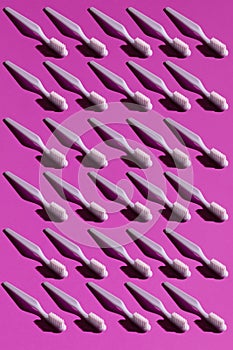 Toothbrush on the pink background seamless pattern. Trendy stylish health care concept. Time to brush your teeth.