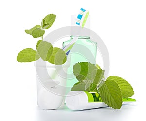 Toothbrush with toothpaste and fresh leaves of mint