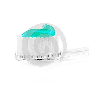 Toothbrush and toothpaste on isolated white