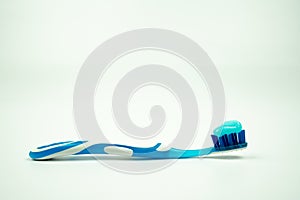 Toothbrush with toothpaste isolated on a white background