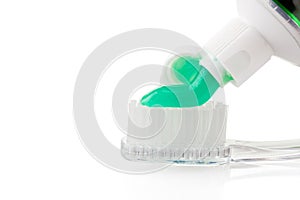 Toothbrush and toothpaste on isolated white background