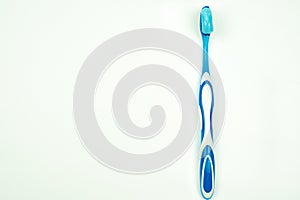 Toothbrush with toothpaste isolated on a white background top view