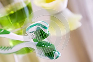 Toothbrush with toothpaste and rinsing liquid