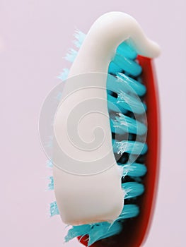 toothbrush on white background with toothpaste. Toothpaste on a white toothbrush. Toothbrush - macro. Toothpaste - close-up