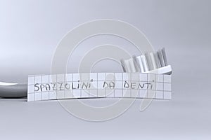 Toothbrush written on a small paper, spazzolini da denti in Italian photo