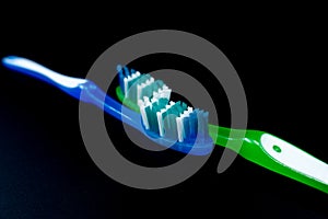 Toothbrushes on a black background