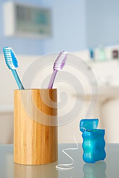 Toothbrushes and dental floss photo