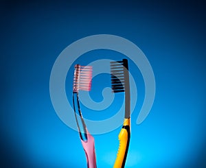 Toothbrushes look at each other. Couple relationship. Love concept