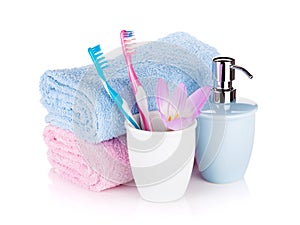 Toothbrushes, soap, two towels and flower